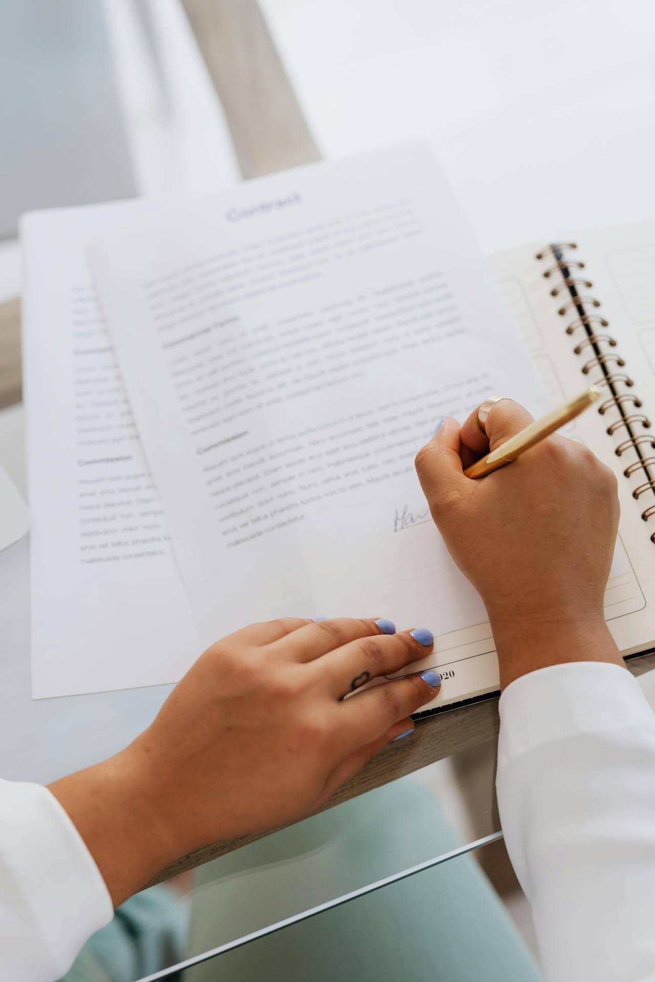 person signing a document